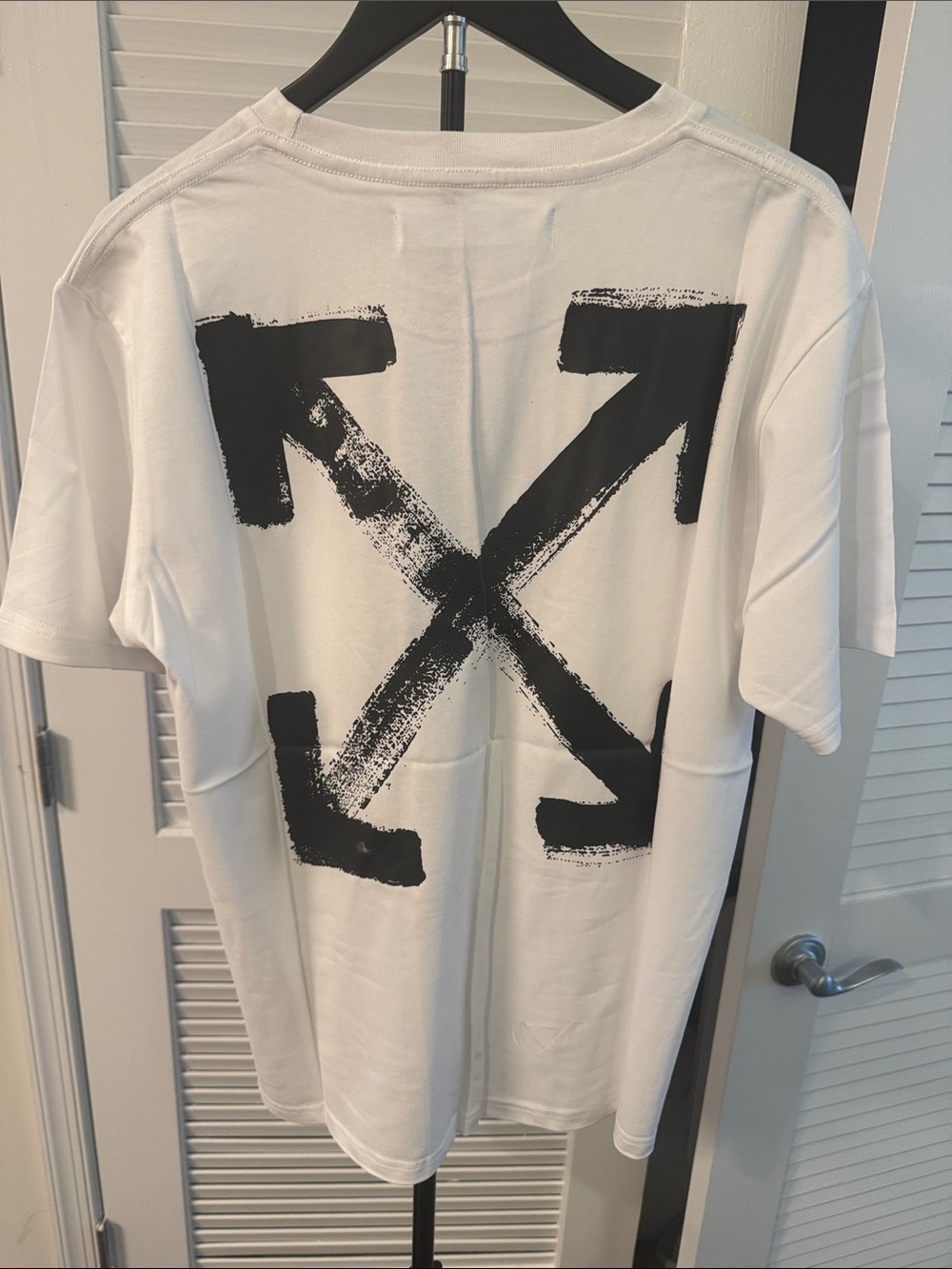 New! Off-White Paint Arrow Tee, a popular streetwear top.